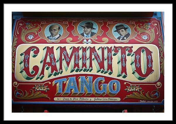 A colorful vintage-style signboard featuring the text Caminito Tango with portraits of three men above it.