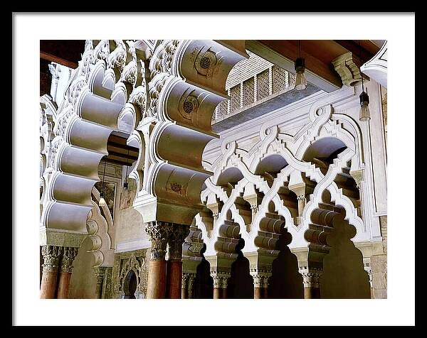 Intricate mudejar arches in the patio de santa isabel aljaferia palace travel essayist